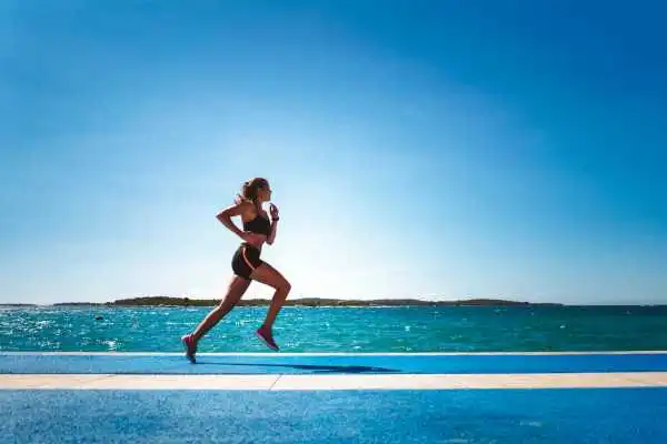 Woman running showing strong leg muscle Walsall Wood